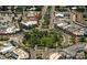 Aerial view of a charming neighborhood roundabout offering lush greenery and a sense of community at 767 John Ringling Blvd # 25, Sarasota, FL 34236