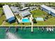 Aerial view of waterfront complex featuring a marina, pool, shuffleboard, and parking at 767 John Ringling Blvd # 25, Sarasota, FL 34236