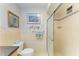 Tiled bathroom with a toilet, shower, decorative accents, and ample lighting at 767 John Ringling Blvd # 25, Sarasota, FL 34236