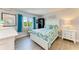 Bright bedroom features queen bed, side table and closet at 767 John Ringling Blvd # 25, Sarasota, FL 34236