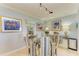 Dining room features glass table, striped chairs and adjacent to living area at 767 John Ringling Blvd # 25, Sarasota, FL 34236