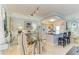 Dining area is adjacent to open kitchen and features a glass table with six chairs at 767 John Ringling Blvd # 25, Sarasota, FL 34236