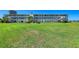 Beautiful multi-story condo building with well-manicured lawn and direct access to outdoor amenities at 767 John Ringling Blvd # 25, Sarasota, FL 34236