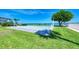 Exterior shot of a community with a meticulously kept lawn and shuffleboard court at 767 John Ringling Blvd # 25, Sarasota, FL 34236