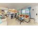 Relaxing living room showcasing a comfortable sofa and connecting views to the kitchen area at 767 John Ringling Blvd # 25, Sarasota, FL 34236