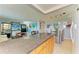 Open concept living features kitchen with counter seating and view of the dining area at 767 John Ringling Blvd # 25, Sarasota, FL 34236