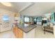 This bright living room is adjacent to kitchen and features access to screened porch at 767 John Ringling Blvd # 25, Sarasota, FL 34236