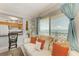 Inviting living room with a peek into the kitchen and scenic window views at 767 John Ringling Blvd # 25, Sarasota, FL 34236
