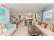Bright living room featuring a relaxed seating arrangement and seamless flow to the adjacent kitchen at 767 John Ringling Blvd # 25, Sarasota, FL 34236