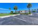 Exterior view of building with landscaped grounds, convenient parking and views of the bay at 767 John Ringling Blvd # 25, Sarasota, FL 34236