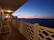 Outdoor patio view with railing overlooking waterfront scenery at dusk at 767 John Ringling Blvd # 25, Sarasota, FL 34236