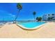 Bright pool area with palm trees at 767 John Ringling Blvd # 25, Sarasota, FL 34236