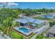Aerial view of the property showcasing the pool, patio, landscaping, and fencing at 7727 9Th Avenue Nw Dr, Bradenton, FL 34209