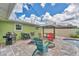 Backyard features a pool, patio, built-in grill, and ample seating for outdoor entertaining at 7727 9Th Avenue Nw Dr, Bradenton, FL 34209