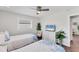Bedroom featuring two twin beds, wood floors, and a ceiling fan at 7727 9Th Avenue Nw Dr, Bradenton, FL 34209