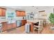 Open kitchen featuring an island, stainless steel appliances, and a connected dining area at 7727 9Th Avenue Nw Dr, Bradenton, FL 34209