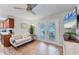 Cozy living room with wood floors, a comfortable sofa, and access to the outdoor patio at 7727 9Th Avenue Nw Dr, Bradenton, FL 34209