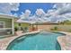 Stunning pool with a tanning ledge, water features, and a spacious patio perfect for entertaining at 7727 9Th Avenue Nw Dr, Bradenton, FL 34209