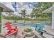 Resort-style pool area with a fire pit, lounge chairs, and lush landscaping for ultimate relaxation at 7727 9Th Avenue Nw Dr, Bradenton, FL 34209