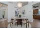 Cozy dining area with a round table, chandelier, and modern decor at 7952 Hampton Ct, University Park, FL 34201