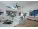 Spacious living room with large windows, hardwood floors, and comfortable seating area at 7952 Hampton Ct, University Park, FL 34201