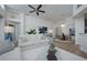 A modern living room with an open floor plan, contemporary furniture, and elegant chandelier at 7952 Hampton Ct, University Park, FL 34201