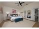 This spacious main bedroom features a ceiling fan and an ensuite bathroom at 7952 Hampton Ct, University Park, FL 34201