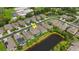 Aerial view of a residential area, highlighting the homes location near a pond at 843 Molly Cir, Sarasota, FL 34232