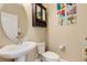 This half bathroom features a pedestal sink, large mirror, and decorative accents at 843 Molly Cir, Sarasota, FL 34232