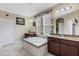 This luxurious bathroom features a soaking tub and separate vanities at 843 Molly Cir, Sarasota, FL 34232
