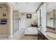This bathroom boasts a large soaking tub, walk-in shower, and double vanity at 843 Molly Cir, Sarasota, FL 34232