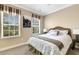 Bedroom featuring neutral walls, a wicker bed, two windows that provides great natural lighting at 843 Molly Cir, Sarasota, FL 34232