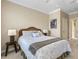 Bedroom featuring a wicker bed frame, neutral paint, and a side table with a lamp for nighttime reading at 843 Molly Cir, Sarasota, FL 34232