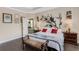 Comfortable bedroom features wooden floors, a large decorative headboard, and neutral paint at 843 Molly Cir, Sarasota, FL 34232