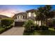 Charming two-story home with lush landscaping and inviting curb appeal at 843 Molly Cir, Sarasota, FL 34232