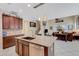 Modern kitchen with granite countertops, stainless steel appliances, wooden cabinets, and a breakfast bar at 843 Molly Cir, Sarasota, FL 34232