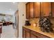 This kitchen boasts ample cabinet space, granite countertops, and stainless steel refrigerator at 843 Molly Cir, Sarasota, FL 34232