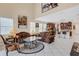 Open-concept living room with high ceilings, tile flooring, comfortable seating, and access to the kitchen at 843 Molly Cir, Sarasota, FL 34232