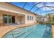 Relaxing screened pool area with patio seating for outdoor enjoyment at 843 Molly Cir, Sarasota, FL 34232