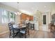 View of a dining room with wood floors, chairs, and natural light at 8579 54Th Avenue E Cir, Bradenton, FL 34211