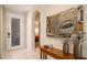 Elegant foyer with neutral tiles, stylish decor, and an open floor plan at 8579 54Th Avenue E Cir, Bradenton, FL 34211