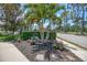 Well-manicured landscaping with tropical plants and decorative heron statues at 8579 54Th Avenue E Cir, Bradenton, FL 34211