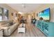 Open living room with beach decor and view to dining and kitchen areas at 8579 54Th Avenue E Cir, Bradenton, FL 34211