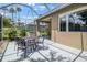 Cozy screened patio for outdoor seating, bordered by lush landscaping at 8579 54Th Avenue E Cir, Bradenton, FL 34211