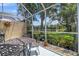 Outdoor seating area with views of the pond. Screened patio at 8579 54Th Avenue E Cir, Bradenton, FL 34211
