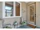 Charming home entrance with decorative accents, comfortable seating, and a welcoming doormat at 8579 54Th Avenue E Cir, Bradenton, FL 34211