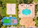 Aerial view of recreational facilities including a pool, volleyball court, and sports court at 8906 Stone Harbour Loop, Bradenton, FL 34212