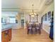 Formal dining area features wood floors, chandelier, and decorative wall art at 8906 Stone Harbour Loop, Bradenton, FL 34212