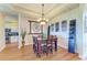 Formal dining room showcasing elegant lighting fixture and modern décor at 8906 Stone Harbour Loop, Bradenton, FL 34212