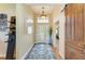 Inviting entryway with a decorative rug, and a view into other rooms at 8906 Stone Harbour Loop, Bradenton, FL 34212